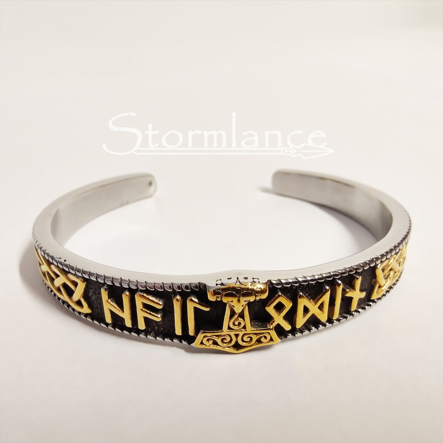 Mjolnir With Elder Futhark Runes Bracelet in Silver and gold color on a white background