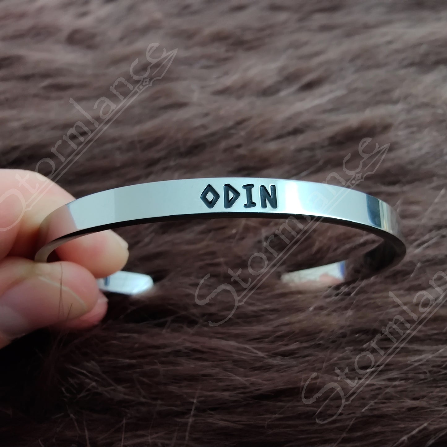 Modern Simple Design Odin Arm Ring (Cuff) placed on a wooden desk