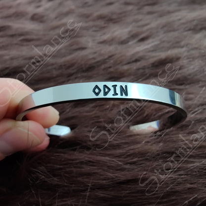 Modern Simple Design Odin Arm Ring (Cuff) placed on a wooden desk