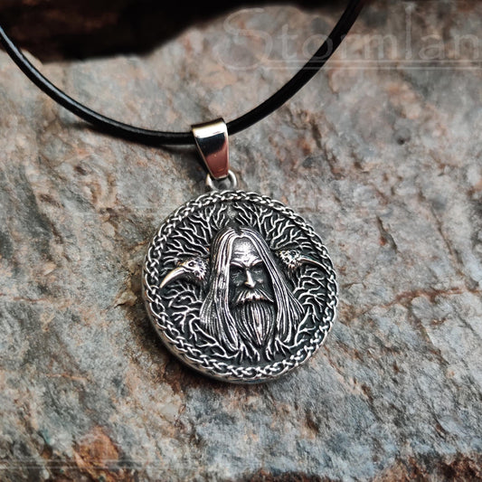 Odin allfather pendant made of stainless steel, laying on a granite stone slab