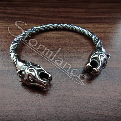 Panther Bracelet made of stainless steel laying on a wooden table