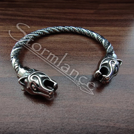 Panther Bracelet made of stainless steel laying on a wooden table