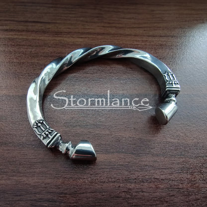 Sleipnir Horse Arm Ring made of Stainless Steel on a wooden background